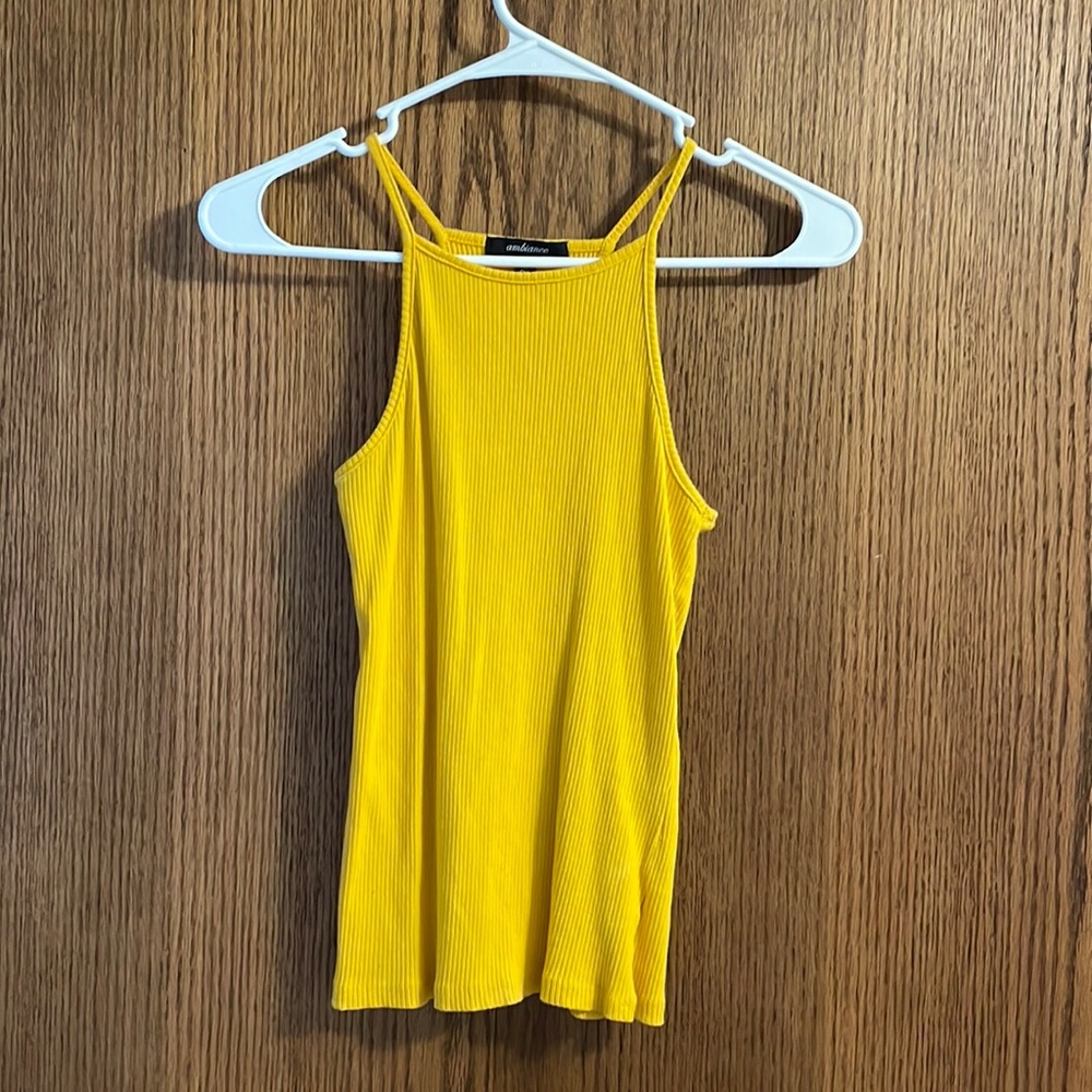 Woman’s yellow tank top